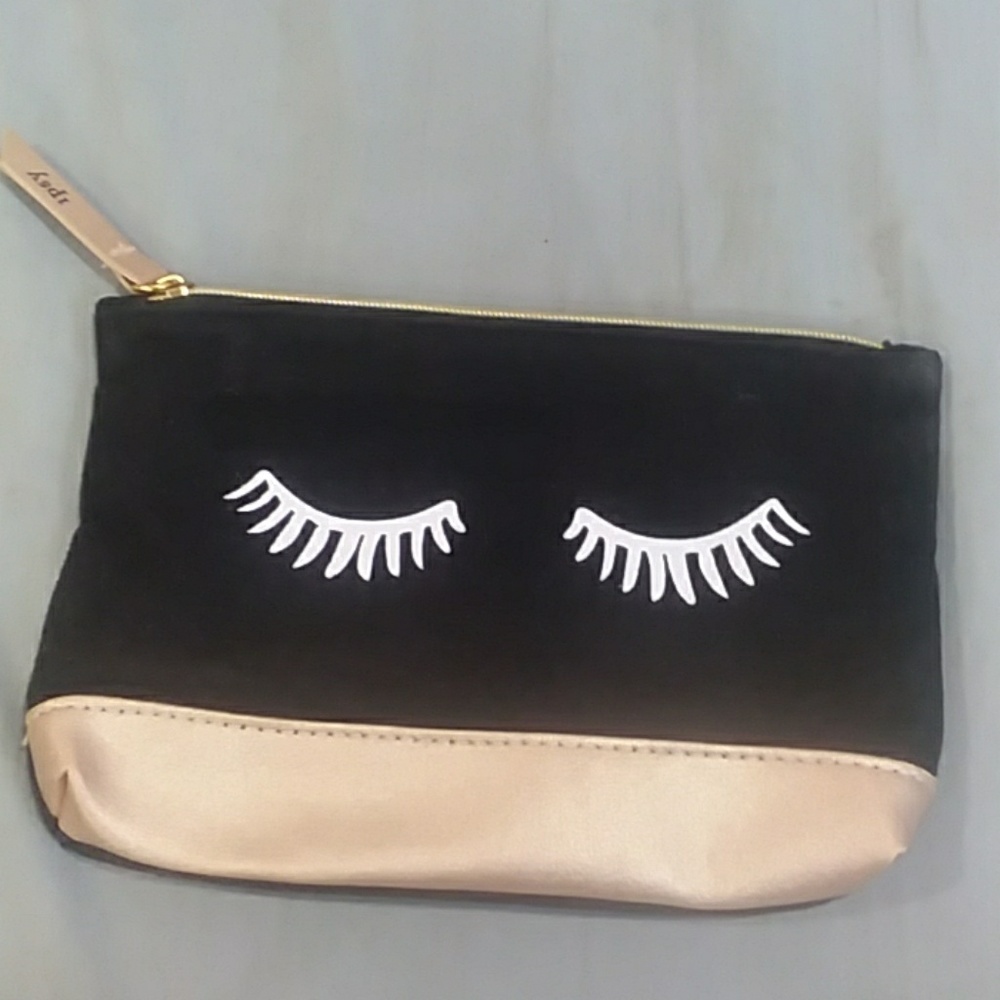 cute "rules were made to be broken" eyelash clutch